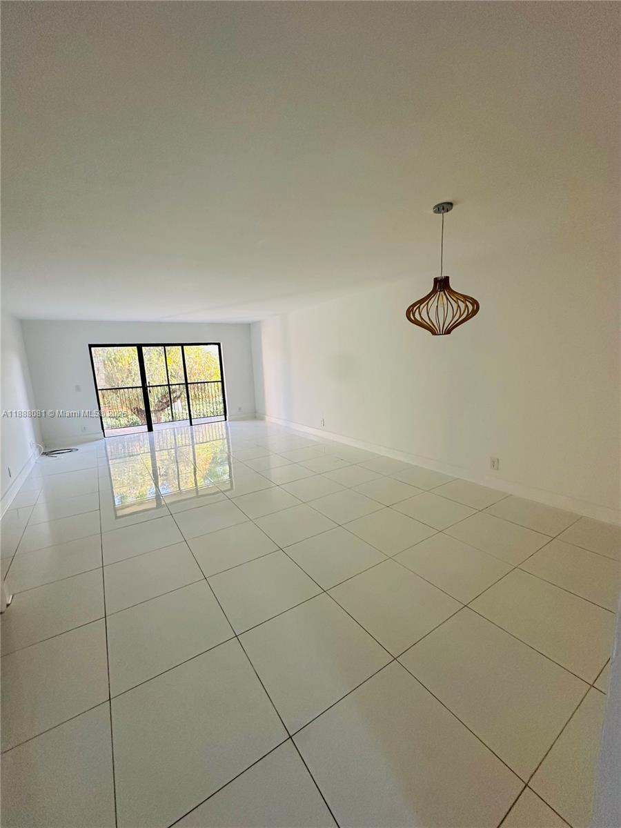 16491 Blatt Boulevard, Unit 202 Weston, FL 33326 - Photo 13 of 21 a view of an empty room with windows