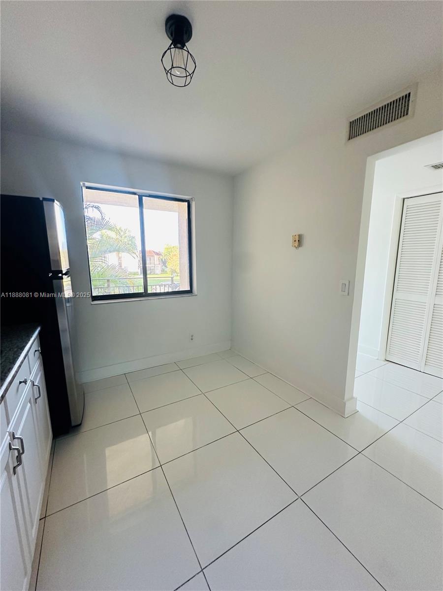 16491 Blatt Boulevard, Unit 202 Weston, FL 33326 - Photo 16 of 21 a view of an empty room with a window