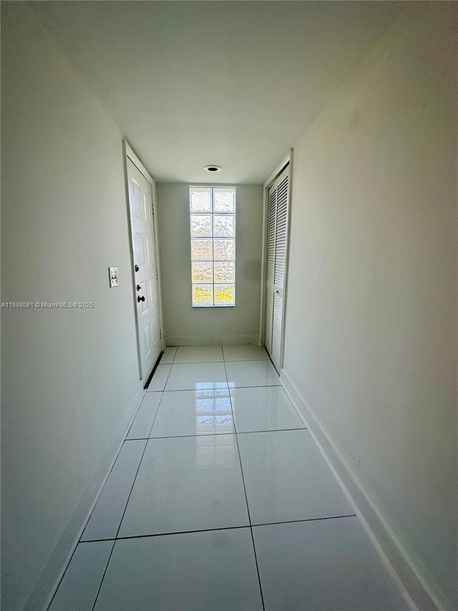 16491 Blatt Boulevard, Unit 202 Weston, FL 33326 - Photo 2 of 21 a view of an empty room with a window