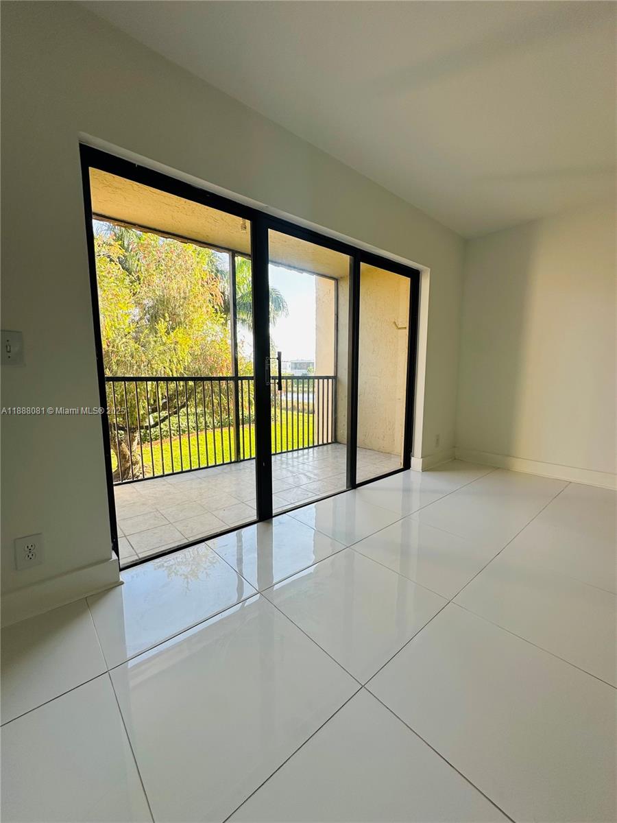 16491 Blatt Boulevard, Unit 202 Weston, FL 33326 - Photo 7 of 21 a view of an empty room with a window