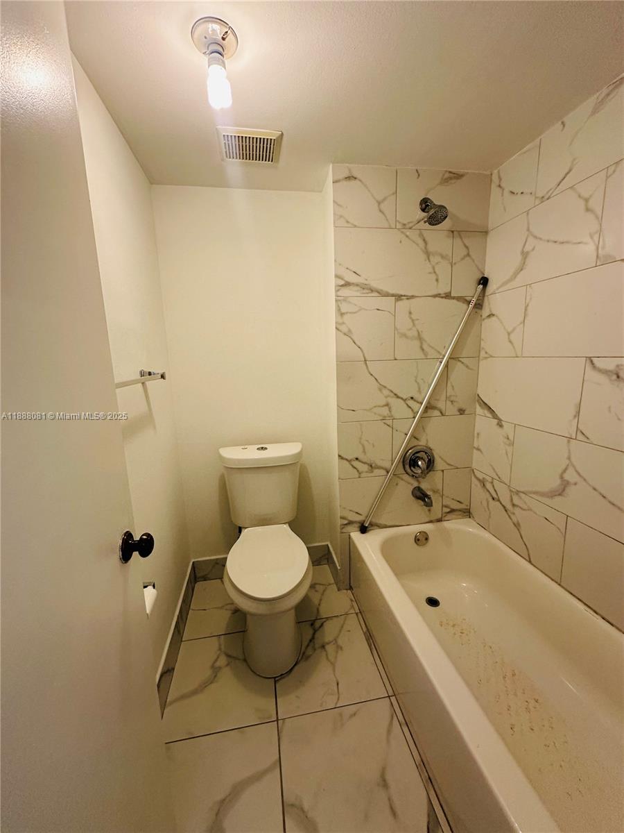 16491 Blatt Boulevard, Unit 202 Weston, FL 33326 - Photo 10 of 21 a bathroom with a sink and a toilet
