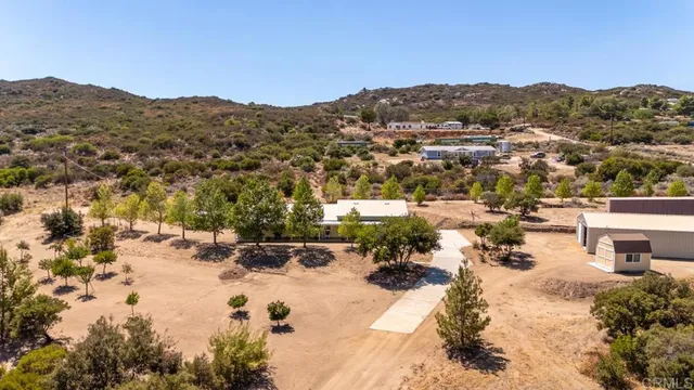 a view of a town with mountains in the background