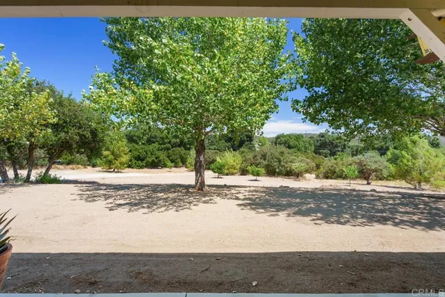 a backyard of a house with lots of green space