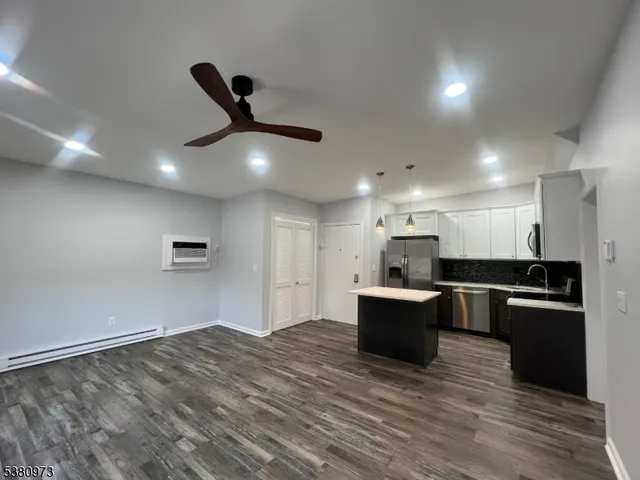 a kitchen with a sink and refrigerator
