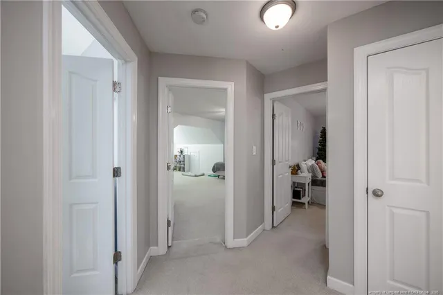 a bedroom with bed and window