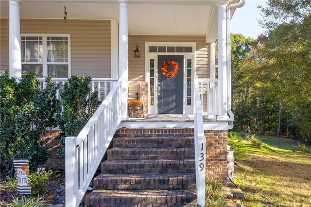 a view of a house with entrance gate