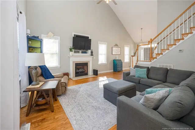 a living room with furniture fireplace and a flat screen tv