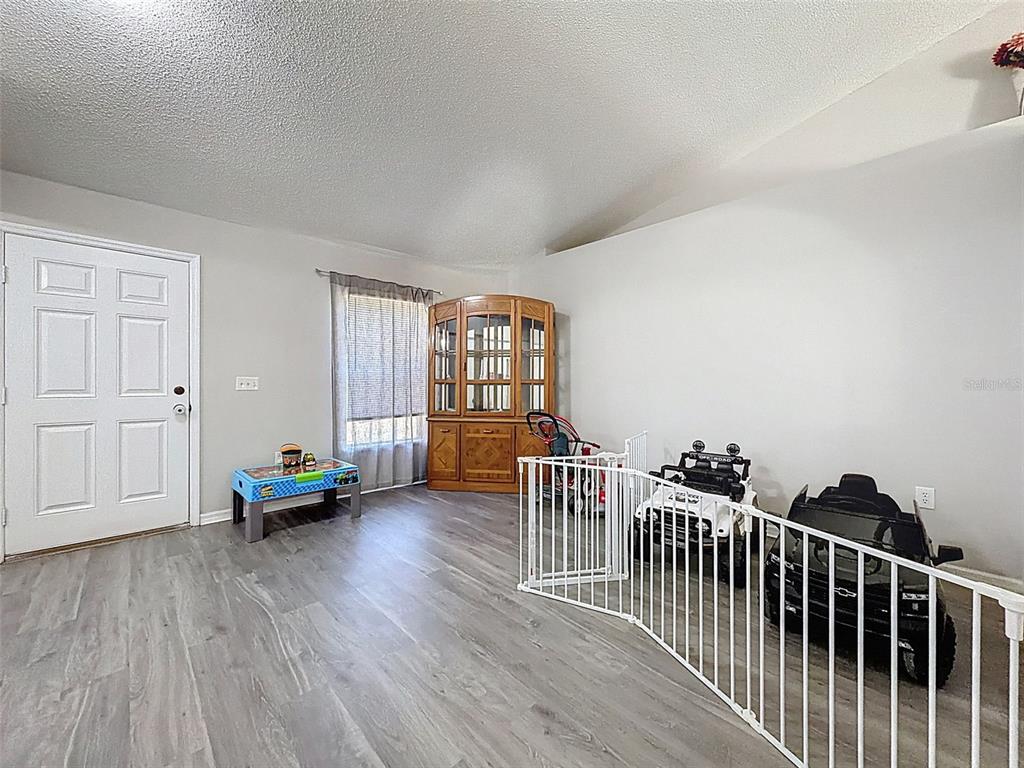 16061 Cave Swallow Road Brooksville, FL 34614 - Photo 42 of 47 a view of livingroom with furniture and wooden floor