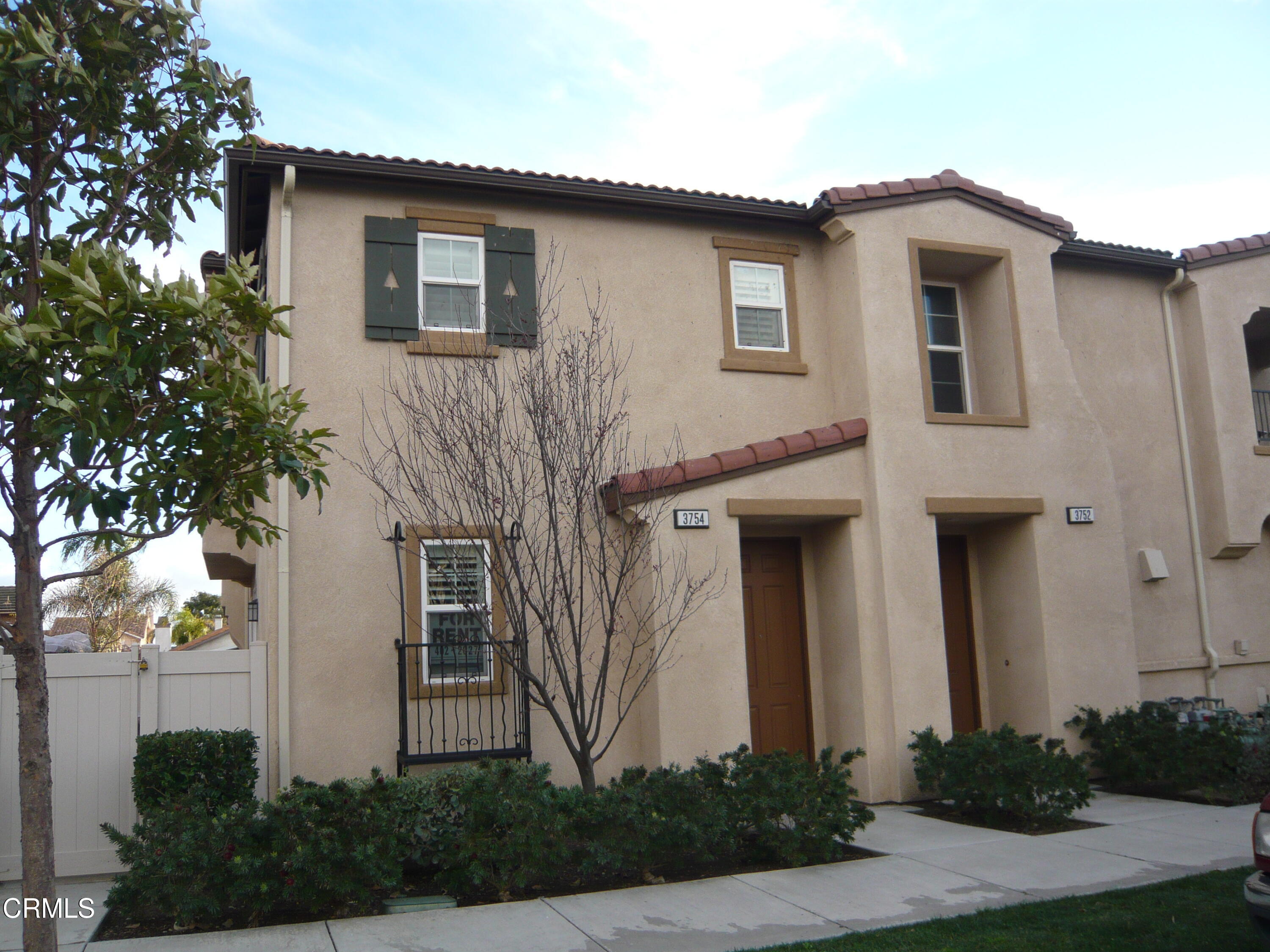3754 Dunkirk Drive Oxnard, CA 93035 - Photo 1 of 16 a front view of a house with plants
