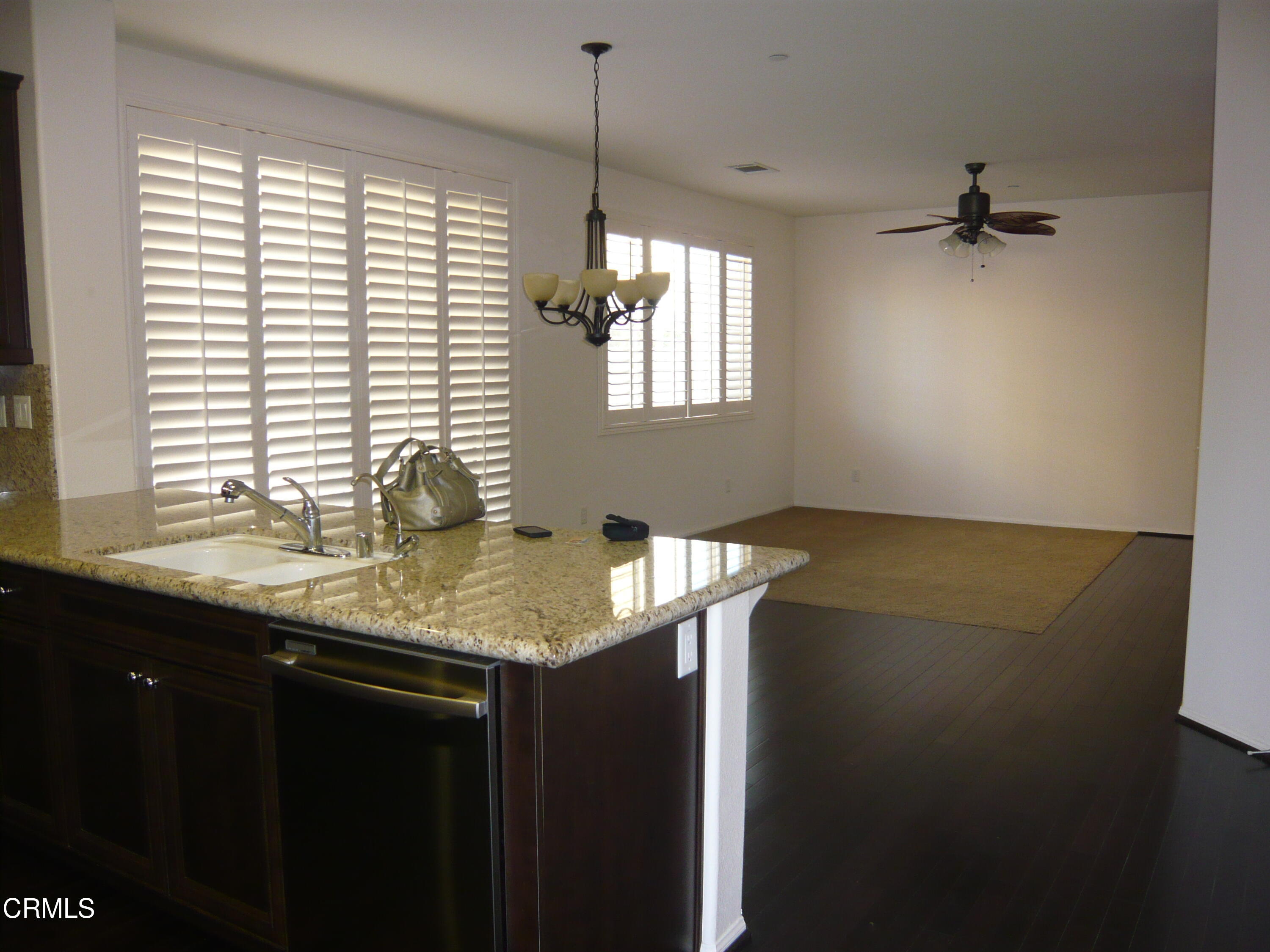 3754 Dunkirk Drive Oxnard, CA 93035 - Photo 4 of 16 a kitchen with a sink a counter top space and a window