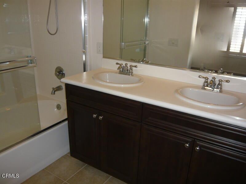 3754 Dunkirk Drive Oxnard, CA 93035 - Photo 10 of 16 a bathroom with a sink and a mirror