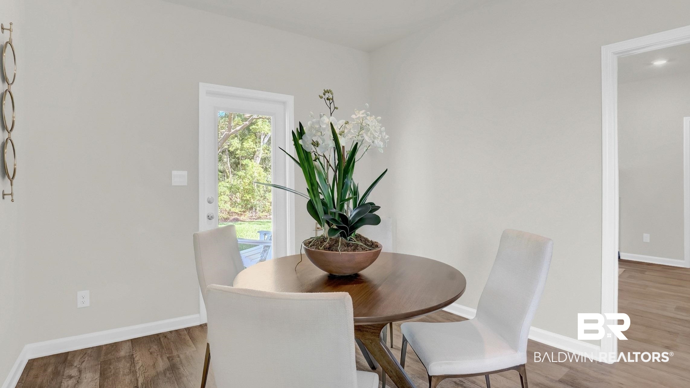 293 Hudson Loop Fairhope, AL 36532 - Photo 17 of 30 Dining area with baseboards and wood finished floors
