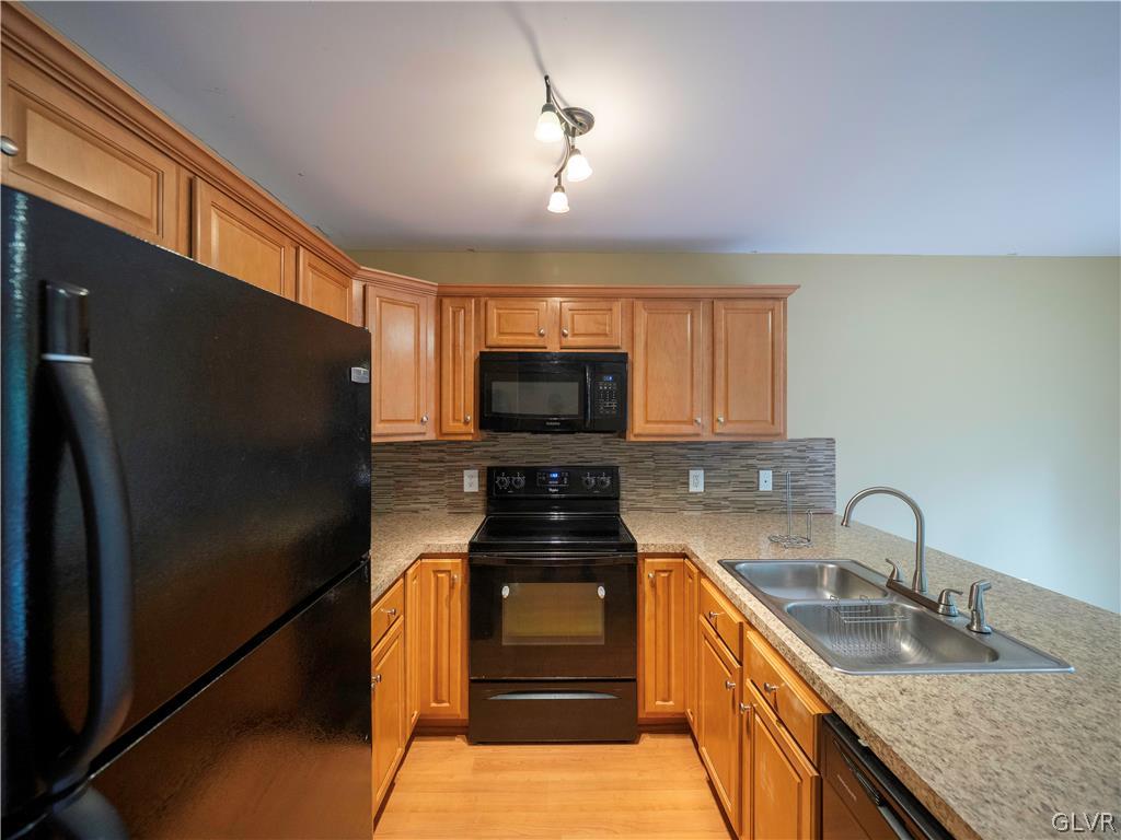 2252 Hillside Road Slatington, PA 18080 - Photo 11 of 29 a kitchen with granite countertop a refrigerator and a sink