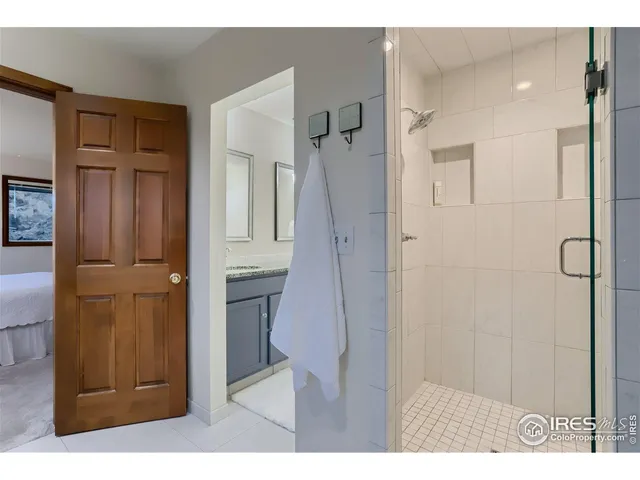 a bathroom with a shower and a sink