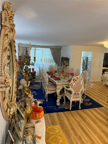 a living room with lots of furniture and a large window