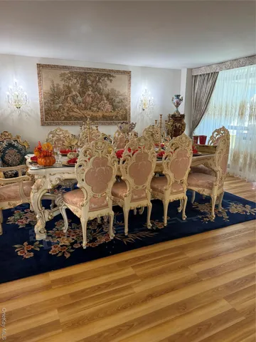 a kitchen with stainless steel appliances a stove a sink and a refrigerator