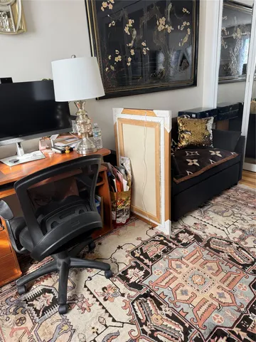 a living room with lots of furniture and a large window