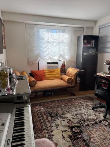 a living room with flat screen tv and furniture