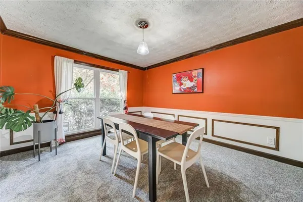 a spacious bedroom with a bed and a desk