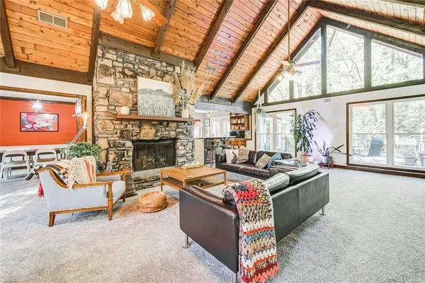 a kitchen with stainless steel appliances granite countertop a refrigerator and wooden cabinets