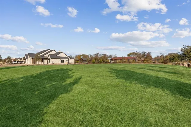 a backyard of a house with lots of green space
