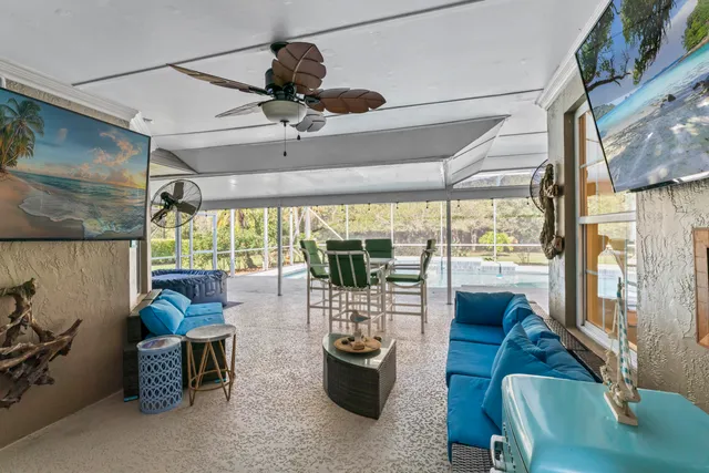 a view of a swimming pool with a patio