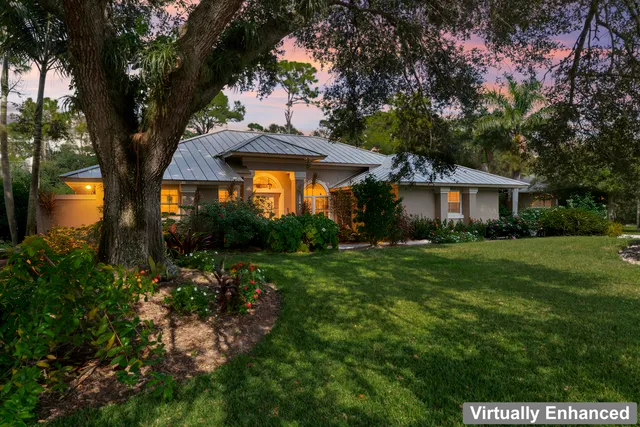 a view of a backyard with wooden floor and seating space