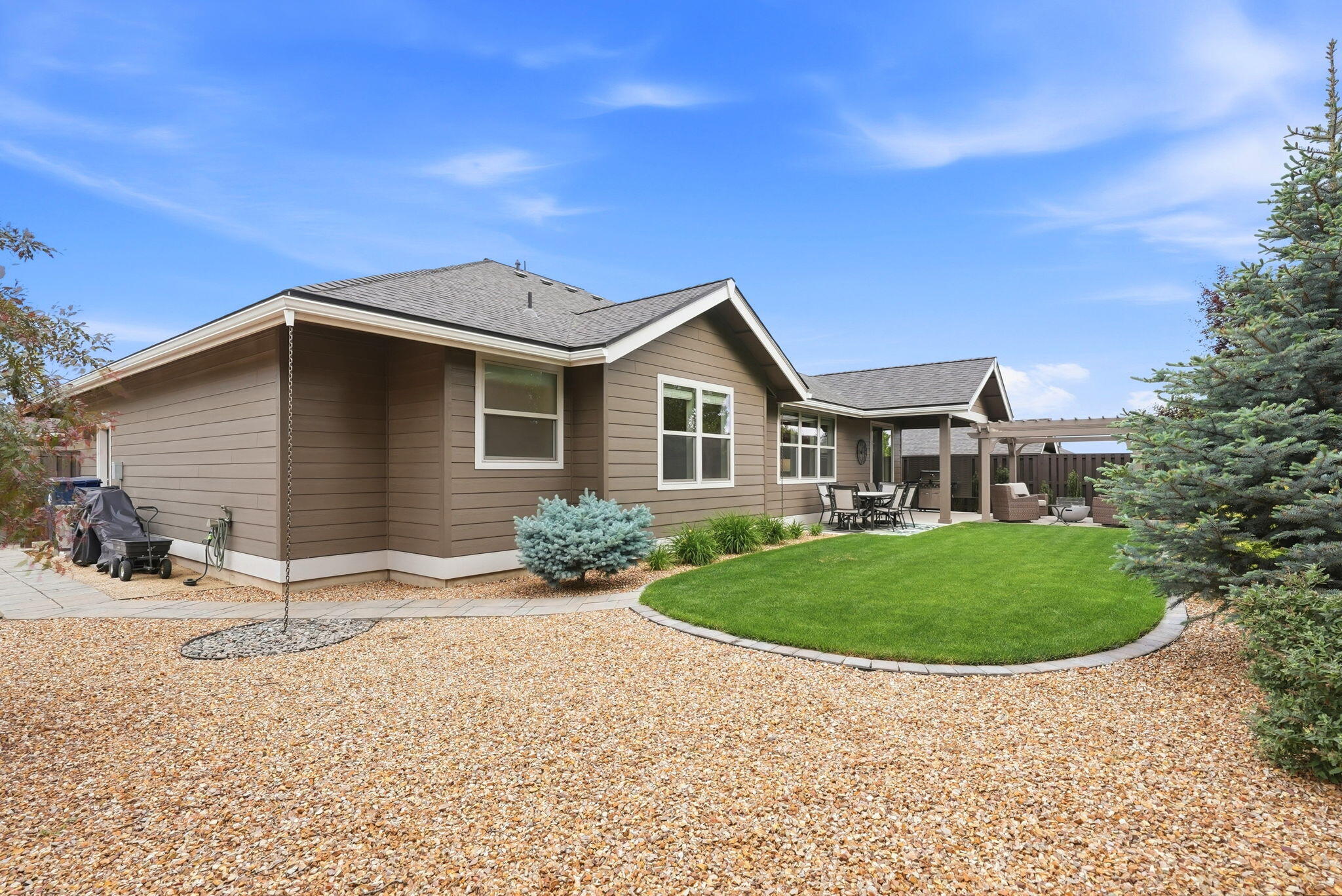 2714 Northwest 23rd Street Redmond, OR 97756 - Photo 45 of 57 a front view of a house with a garden