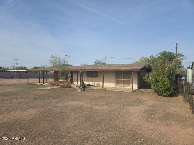 1210 South Desert View Drive Apache Junction, AZ 85120 - Photo 1 of 14 a front view of a house with a yard and garage