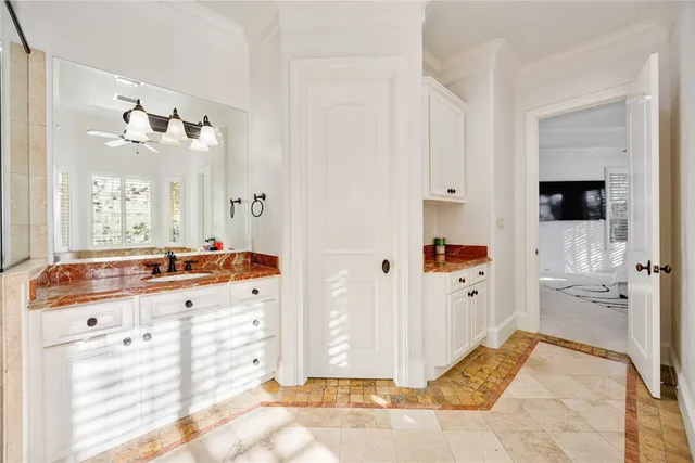 a spacious bathroom with a double vanity sink mirror and