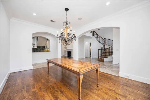 a view of a room with furniture and wooden floor