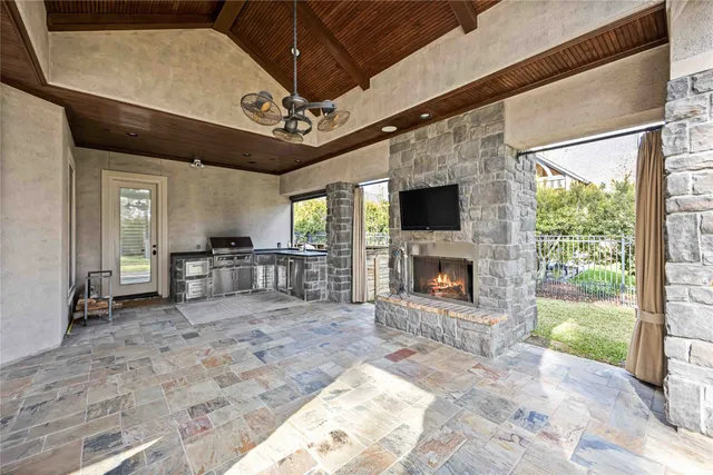 a view of a hallway with a fireplace and a wooden floor
