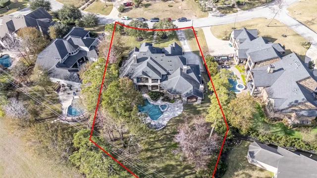 an aerial view of residential houses with outdoor space