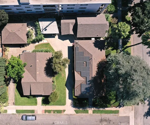 an aerial view of houses with yard