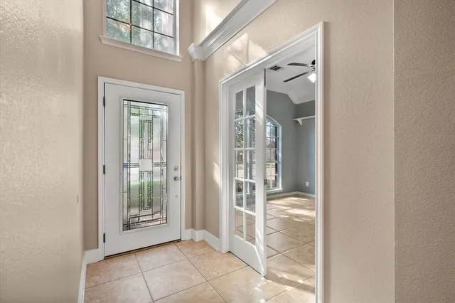 a view of a glass door and a living room