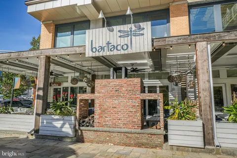 a view of a building with a street sign