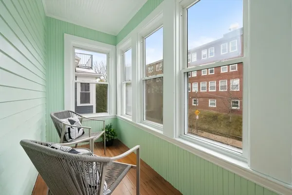 a living room with furniture and windows