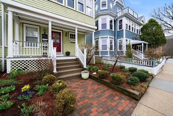 front view of a house with a bench