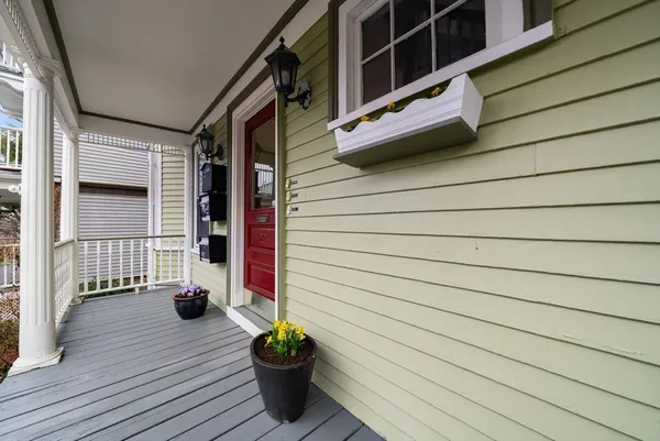 a view of house with potted plants