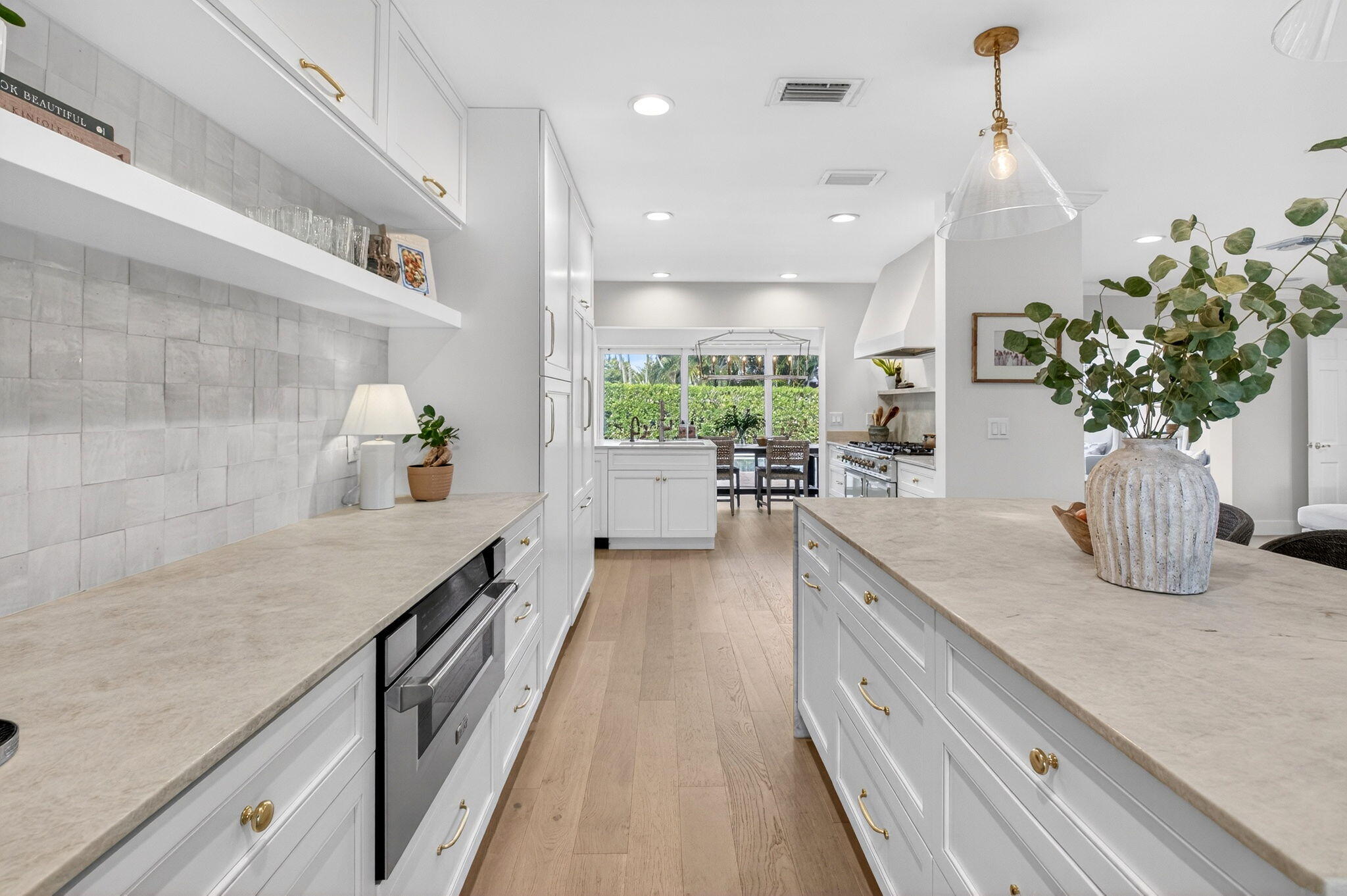 525 Sunset Road Boynton Beach, FL 33435 - Photo 11 of 62 a open kitchen with kitchen island a counter top space a sink appliances and cabinets
