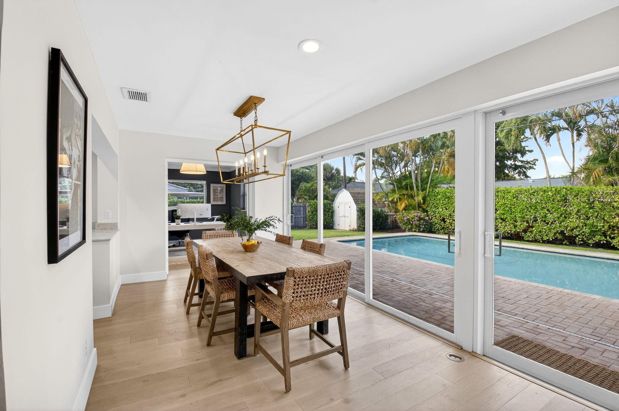 525 Sunset Road Boynton Beach, FL 33435 - Photo 27 of 62 a dining room with furniture a rug and a large window