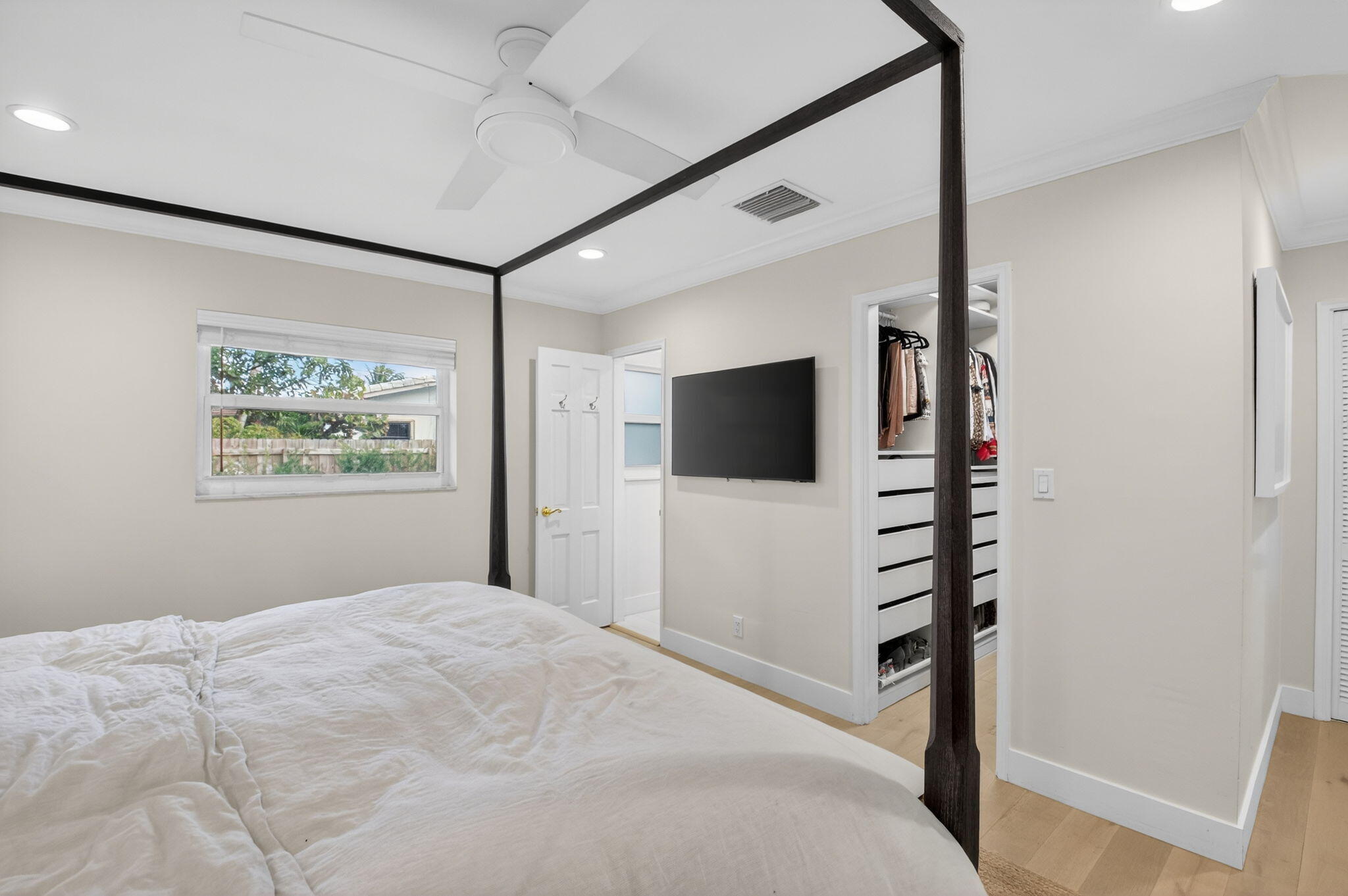 525 Sunset Road Boynton Beach, FL 33435 - Photo 31 of 62 a bedroom with a bed and a flat screen tv