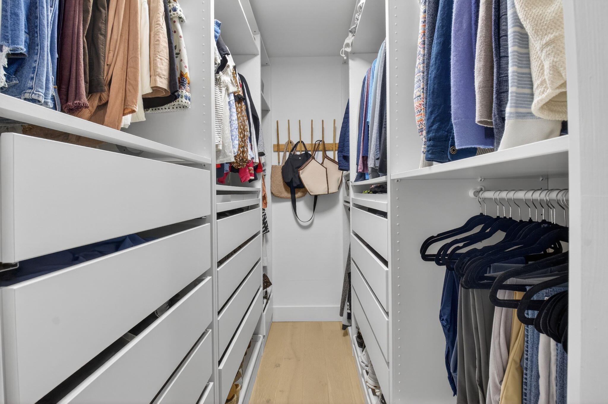 525 Sunset Road Boynton Beach, FL 33435 - Photo 32 of 62 a view of walk in closet with clothes and shoes