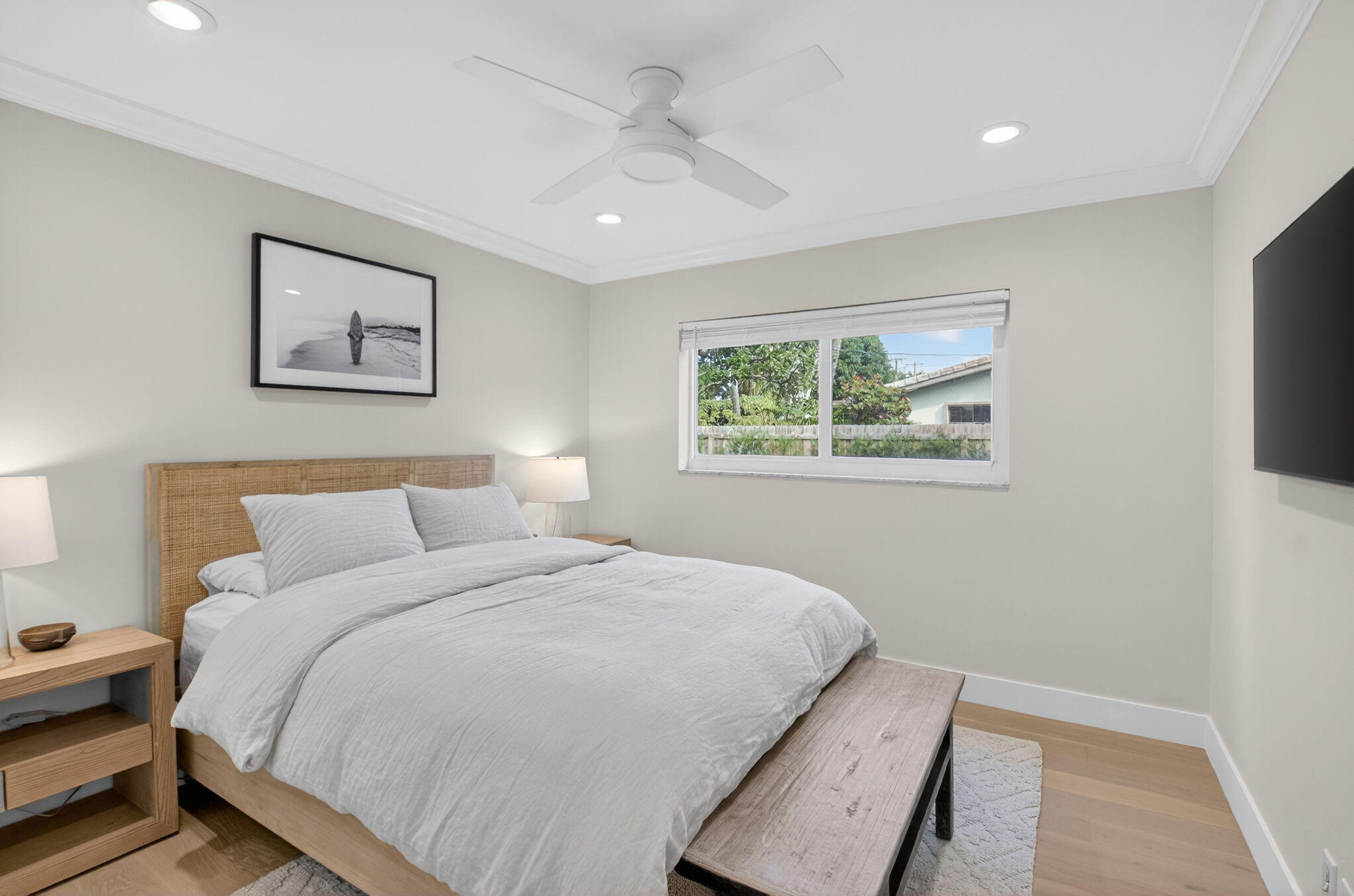 525 Sunset Road Boynton Beach, FL 33435 - Photo 37 of 62 a bedroom with a large bed and a window