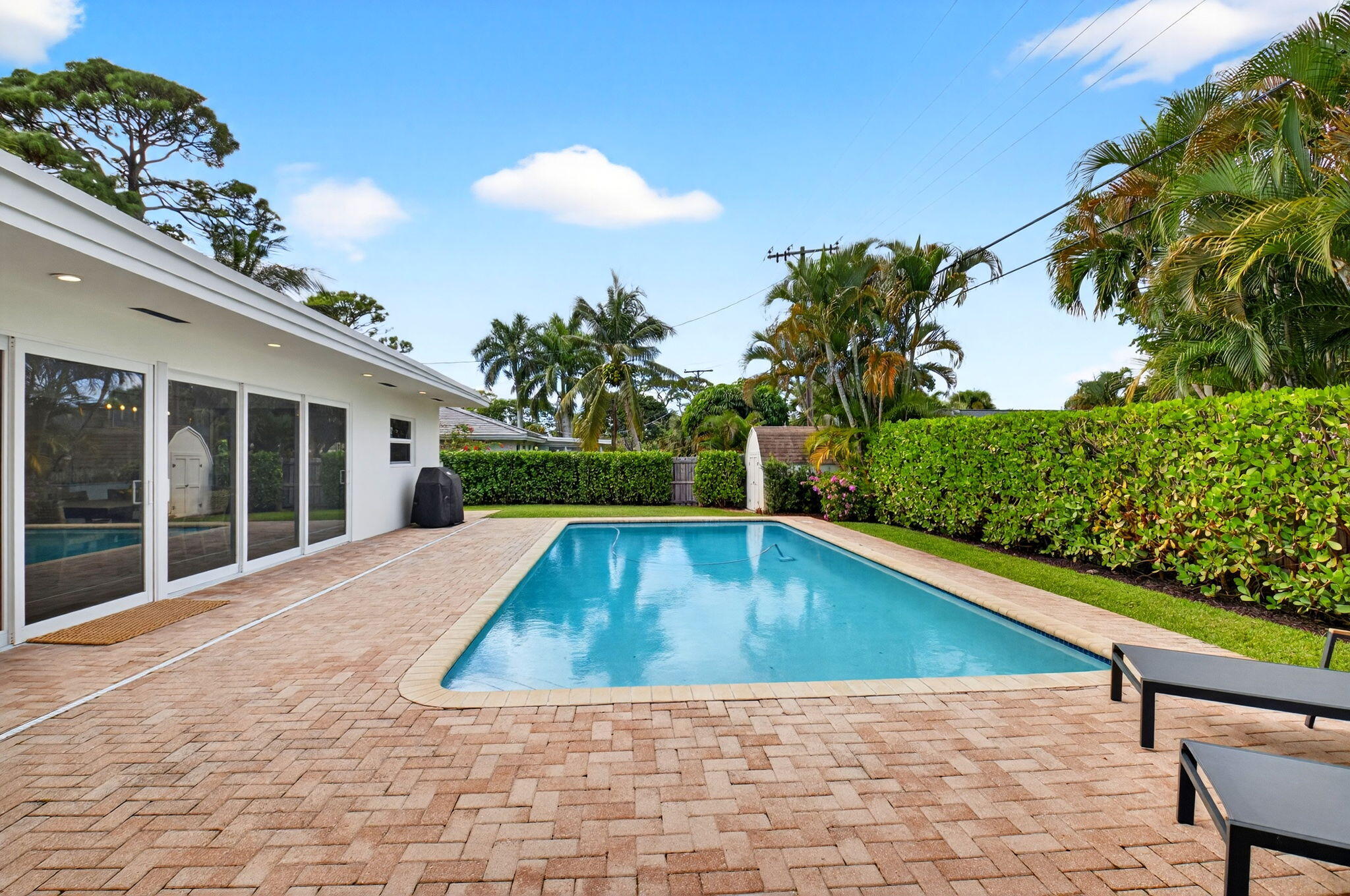 525 Sunset Road Boynton Beach, FL 33435 - Photo 47 of 62 a view of swimming pool with lounge chair