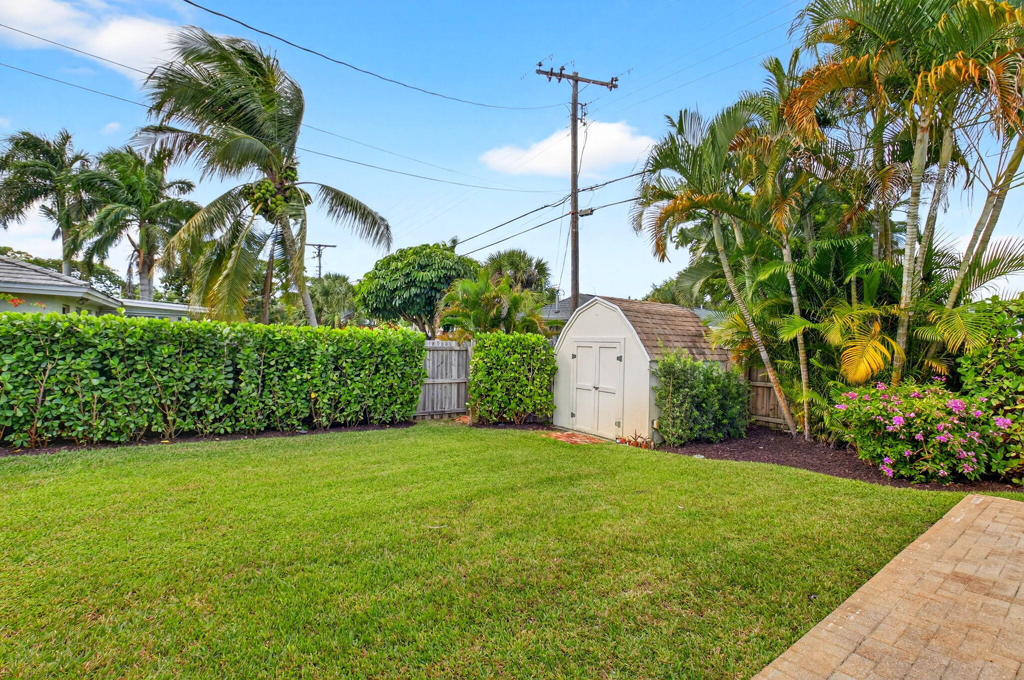 525 Sunset Road Boynton Beach, FL 33435 - Photo 52 of 62 a front view of a house with a yard and garage