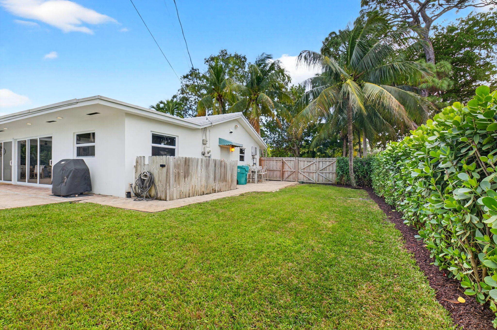 525 Sunset Road Boynton Beach, FL 33435 - Photo 55 of 62 a view of a yard in front of a house with large tree