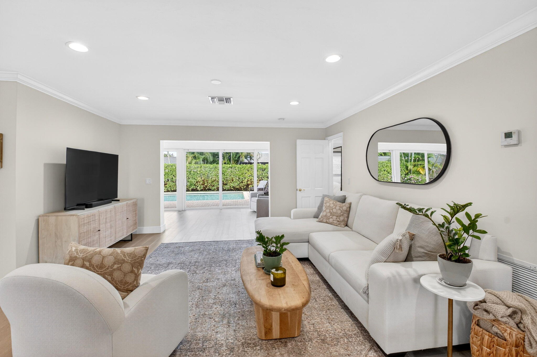 525 Sunset Road Boynton Beach, FL 33435 - Photo 7 of 62 a living room with furniture a window and a flat screen tv