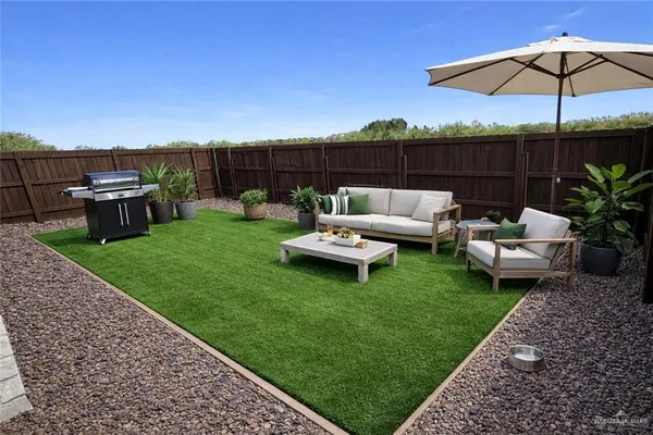 a patio with table and chairs