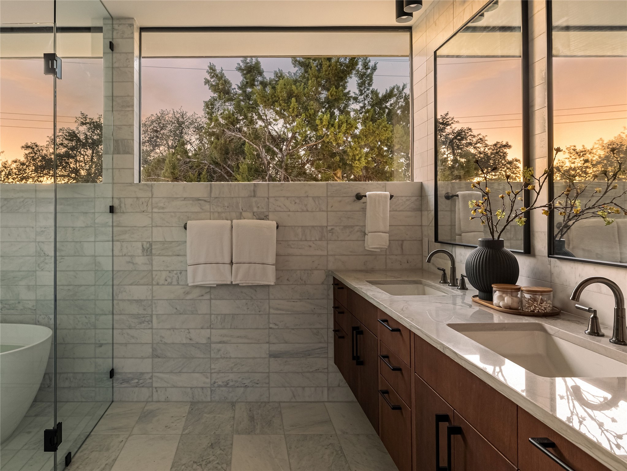 915 Columbus Street Austin, TX 78704 - Photo 21 of 34 Full bath with double vanity, a soaking tub, and tile walls